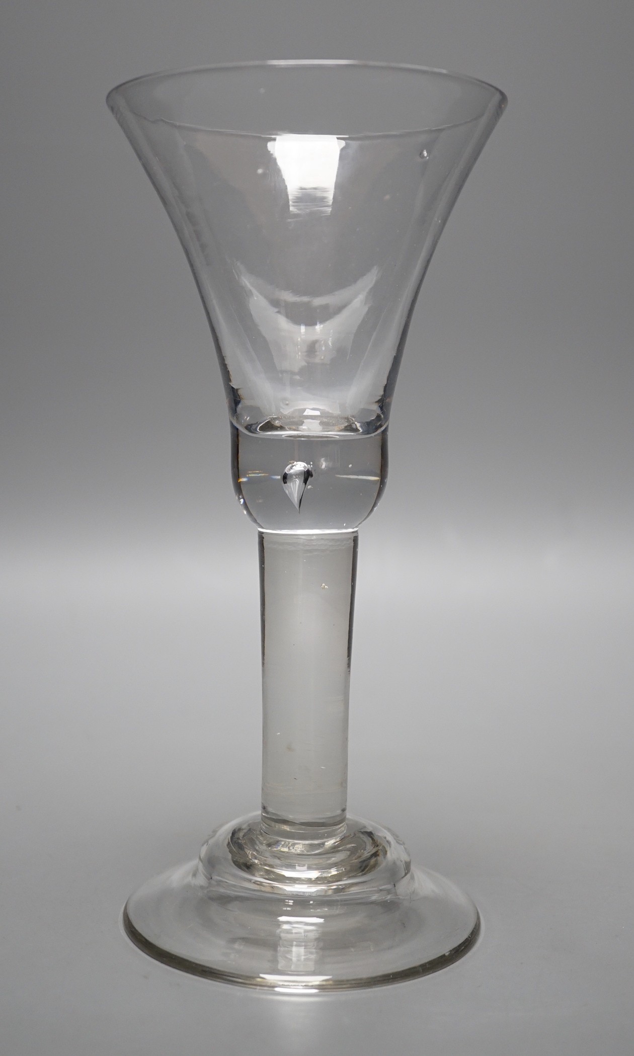 A George II glass goblet, domed foot, 19cm tall